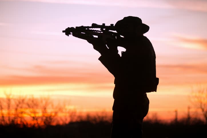 man with cross-bow silhouette man with cross-bow silhouette