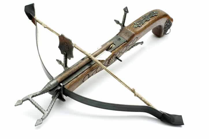 Old Crossbow made of stone and wood isolated in White Background