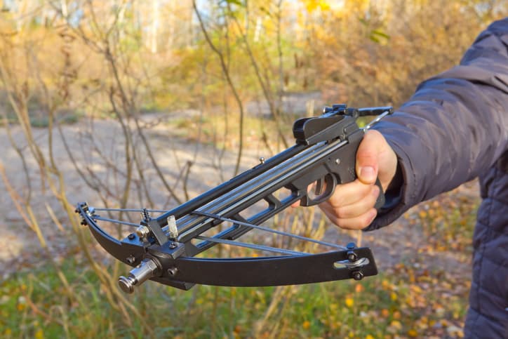 holding pistol crossbow