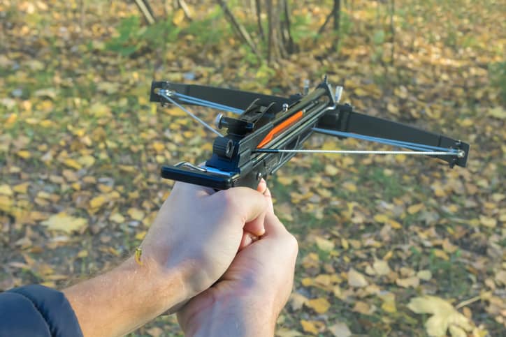 types of crossbows - man holding crossbow